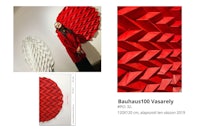 a woman is standing next to a red paper sculpture